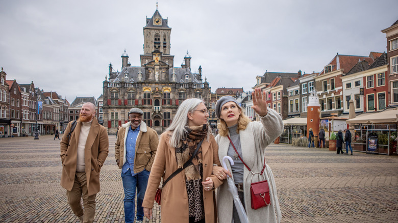 A group of friends in an old European square