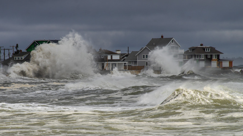 Dangerous storm waves crashing near beach houses