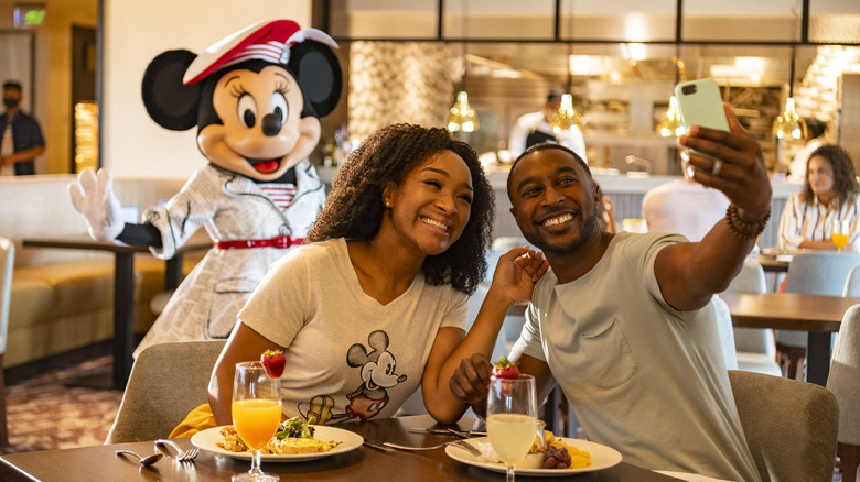 Couple enjoying character meal