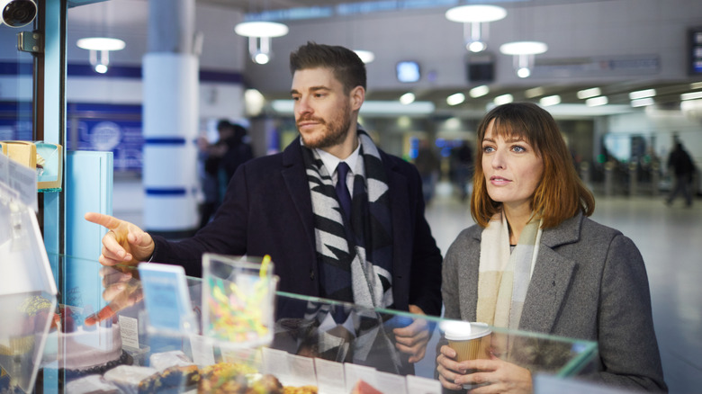 People ordering food at airport