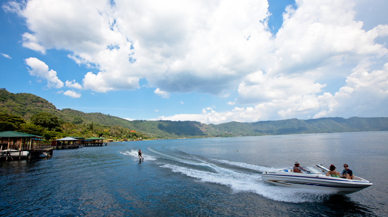 Jet skiing and other water sports are available at Lake Coatepeque.