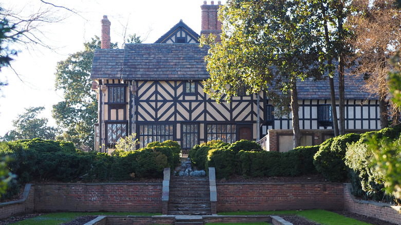 Exterior view of the Tudor facade of Agecroft from the sunken gardens