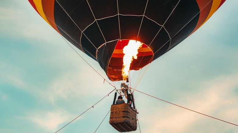 Hot air balloon being elevated by fire.