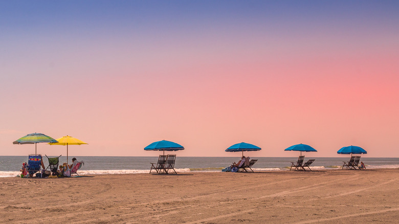 Beach umbrellas and chairs lined up on Surfside Beach