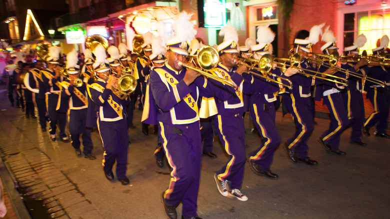 Marching band at Mardi Gras celebration, honoring Cajun culture