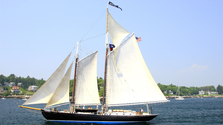 Windjammer ship with large white sails