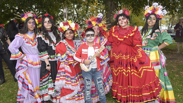 Family dressed in halloween costumes