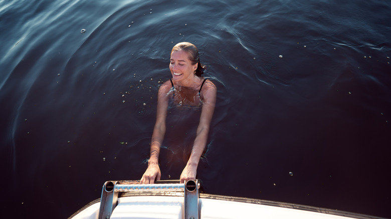 girl swimming in a lake