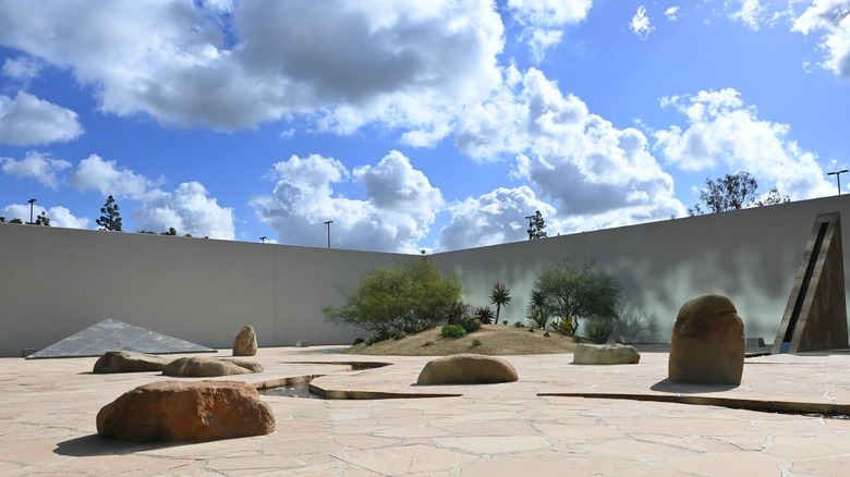 Modern art sculptures in the Noguchi Garden with clouds in the sky