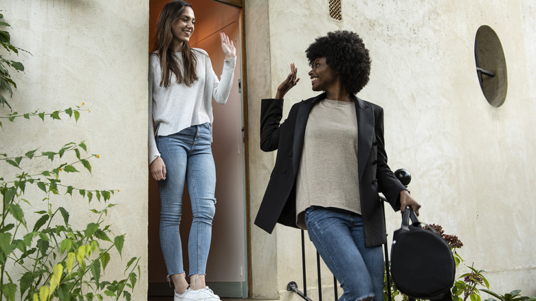 Women waving goodbye