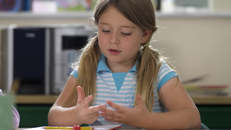 Child counting on fingers