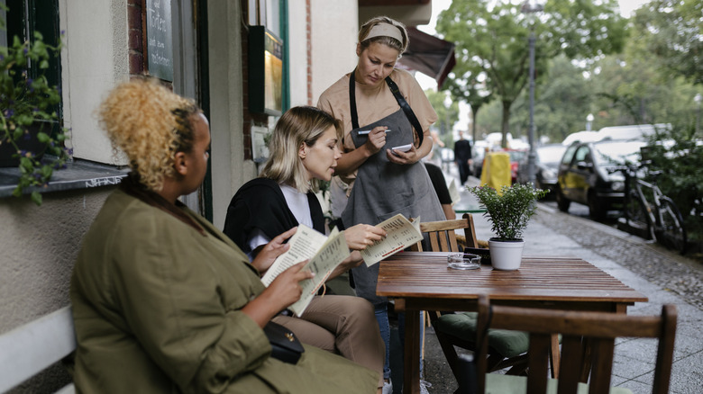 Waitress taking order