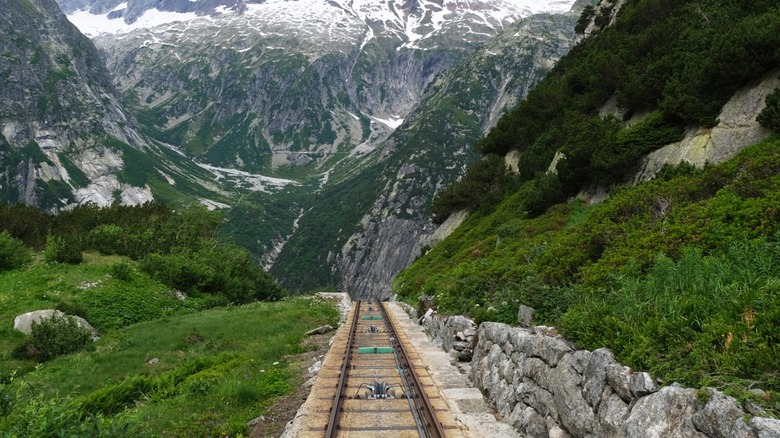 View of the railway tracks of the Gelmerbahn, a funicular in Bern, Switzerland, going down the mountain