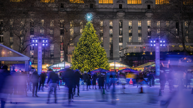 Skating rink and tree at night at Bryant Park Winter Village