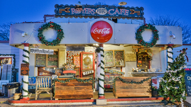 A cafe covered in road signs