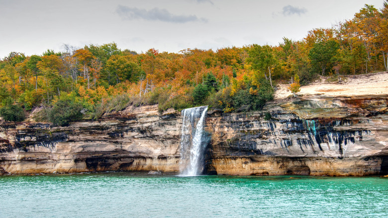 Waterfall cascading off of a sandstone cliff at Spray Falls