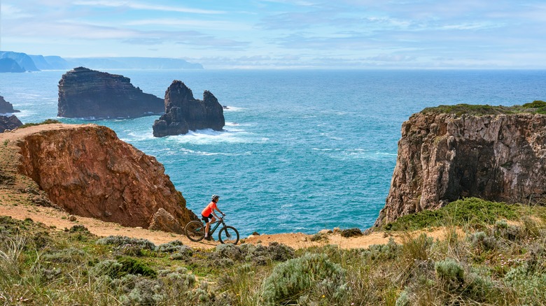 Biking along a dramatic cliff