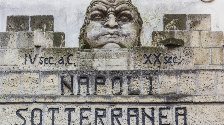 Ancient Naples Underground sign and sculpture