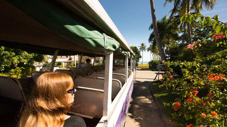 A woman rides a public bus in Fiji