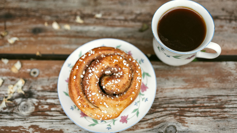 Cinnamon bun and cup of coffee