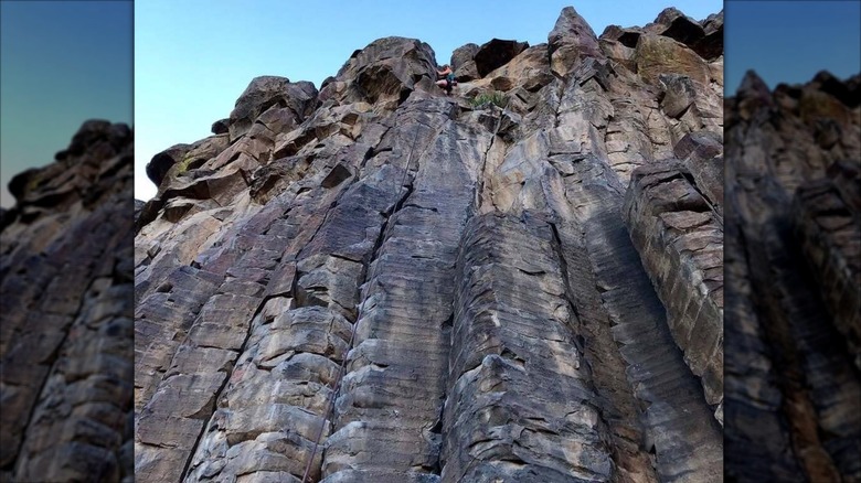 Woman climbing the Black Cliffs in Idaho