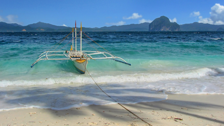 Entalula beach shore boat