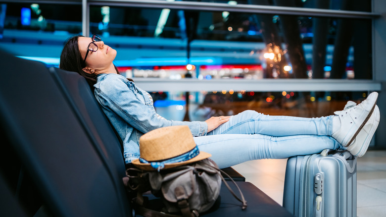 Woman sleeping at airport