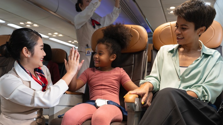 Flight attendant with child