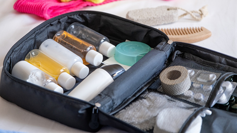 Travel-sized bottles of liquids in a toiletry case