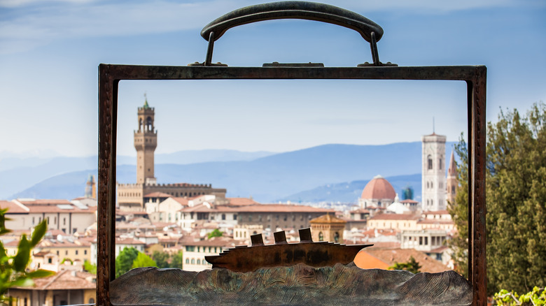 A sculpture by Jean-Michel Folon in the Giardino delle Rose with the city of Florence in the background