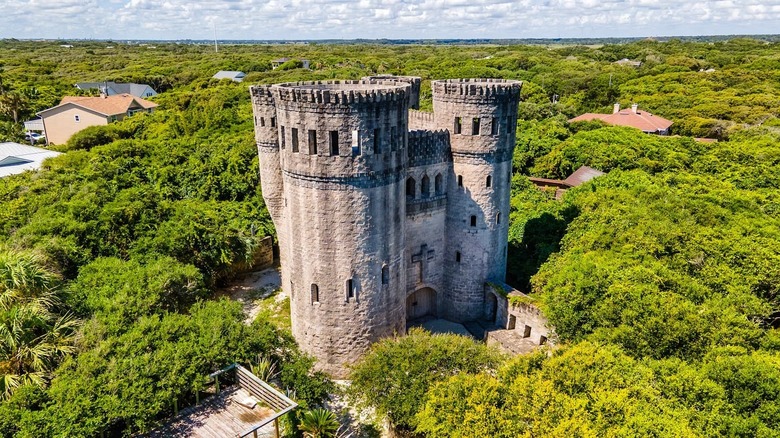 Otttis Castle against forest backdrop