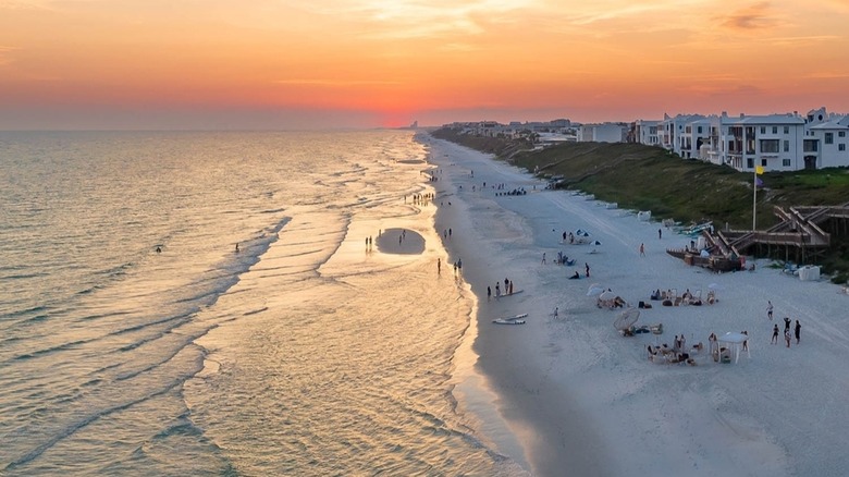 People on the beach at sunset