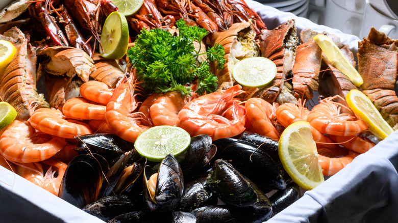 A platter of seafood with shrimp and mussels