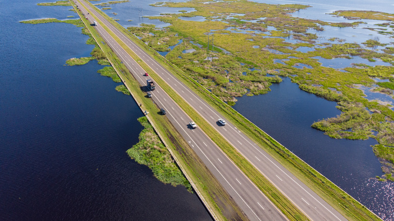 Highway running through Payne's Prairie during a period of high water