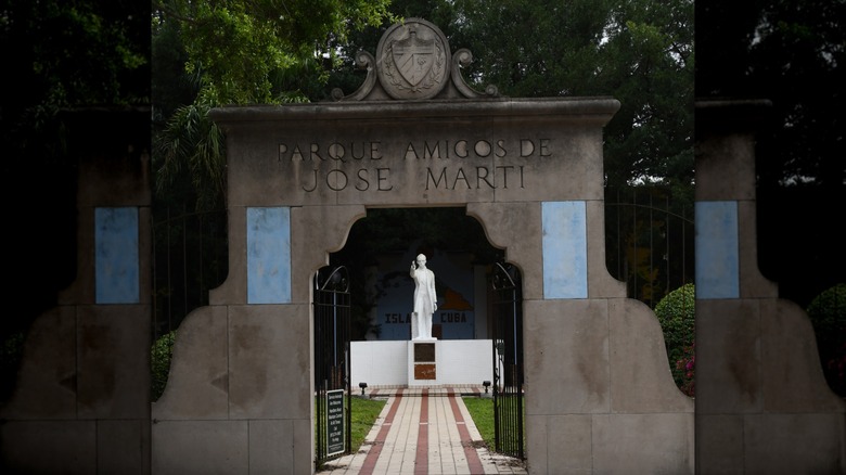 Statue of José Martí seen through the entrance to Parque Amigos de José Martí