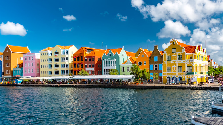 Colorful stretch of buildings on water