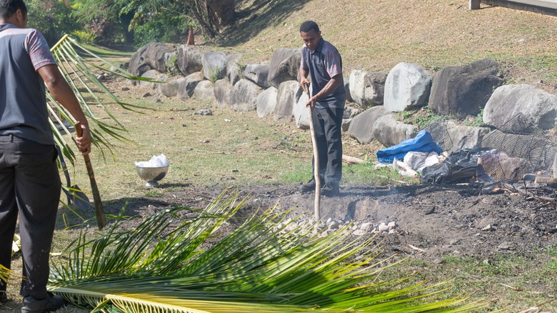 Fijian tending a lovo