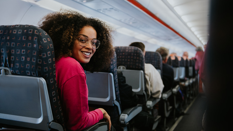 Girl in economy on plane