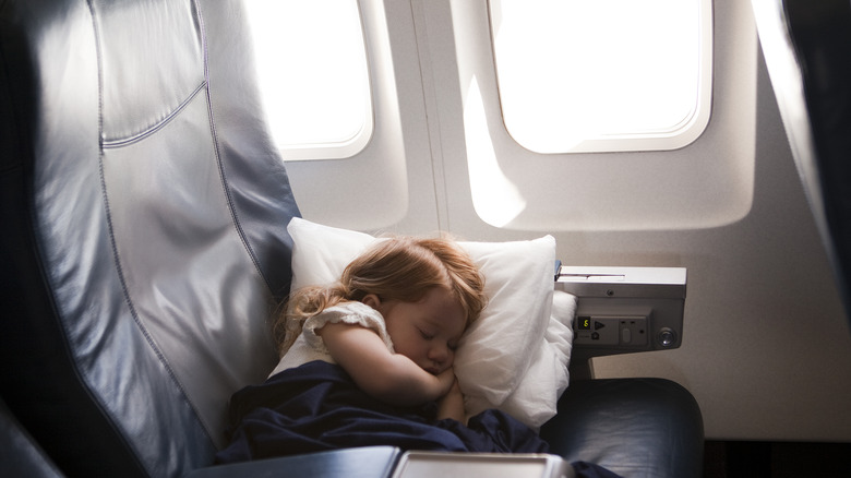 Girl sleeping on plane