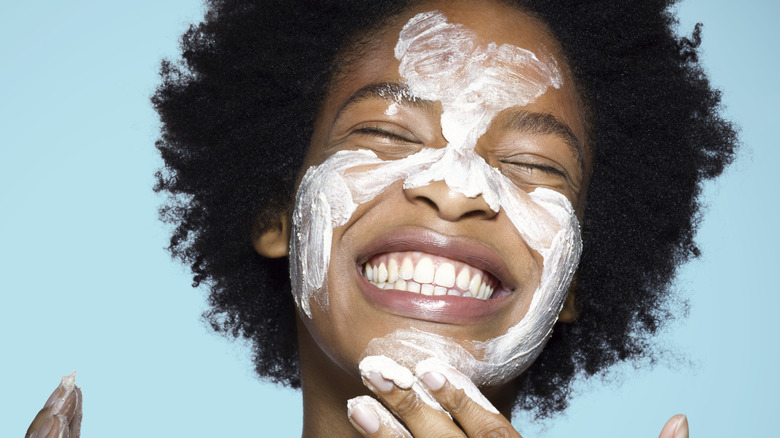 Woman using face cream