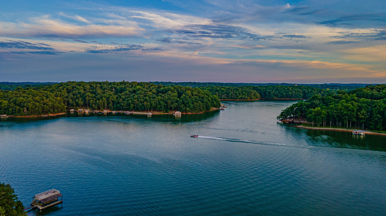 An overview of Lake Lanier with a single boat riding through the water