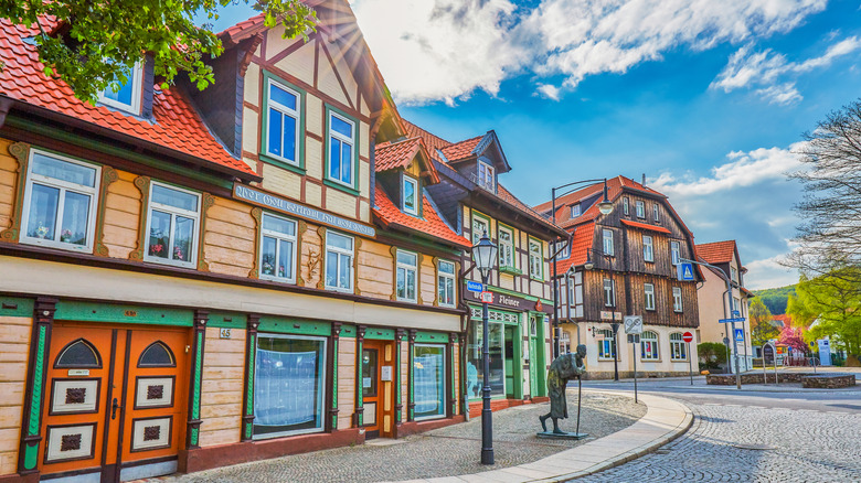 Colorful half-timbered houses and a statue in Wernigerode, Germany