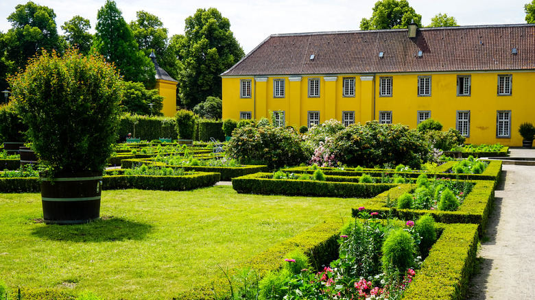 A view of the orangery with parterre gardens