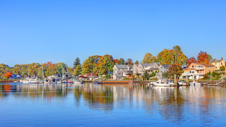 Riverfront houses with autumnal trees in Cranston, Rhode Island