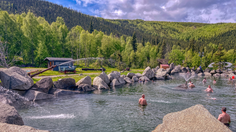 People relaxing in the outdoor lake at Chena Hot Springs Resort