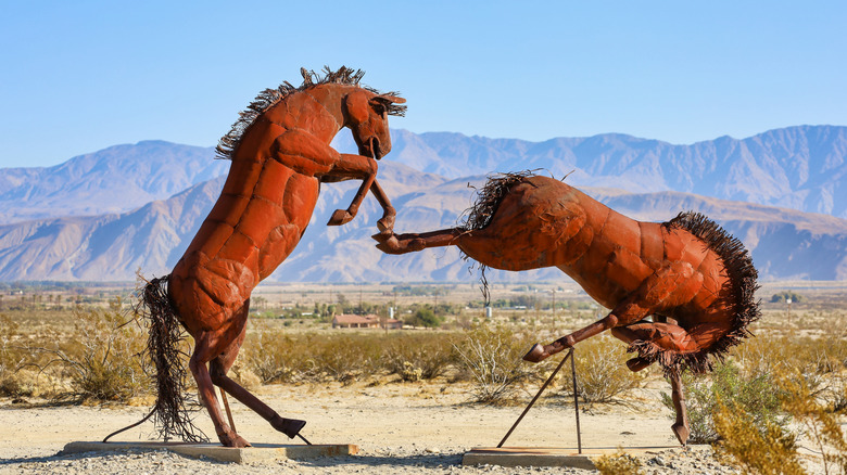 Metal sculpture of wild horses fighting each other at Galleta Meadows