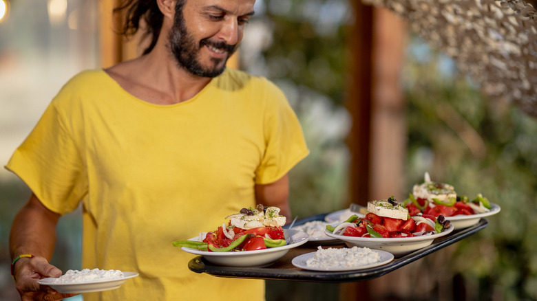 Waiter serving food on Crete, Greece