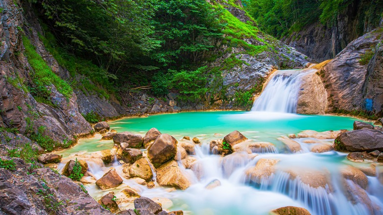 The blue green waters of Kuzalan Waterfall in Turkey