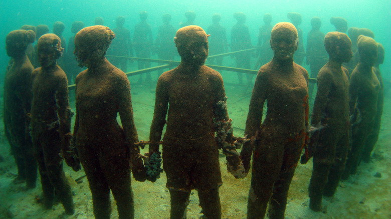 Circle of sunken statues at the Underwater Sculpture Park in Grenada.