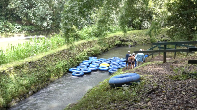 People in their tubes wearing their helmets and gloves